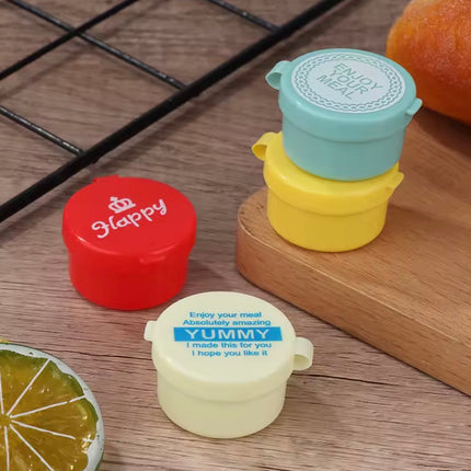 4 زجاجات صلصة صغيرة